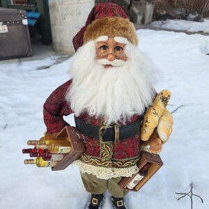 Santa Figurine holding wine and bread